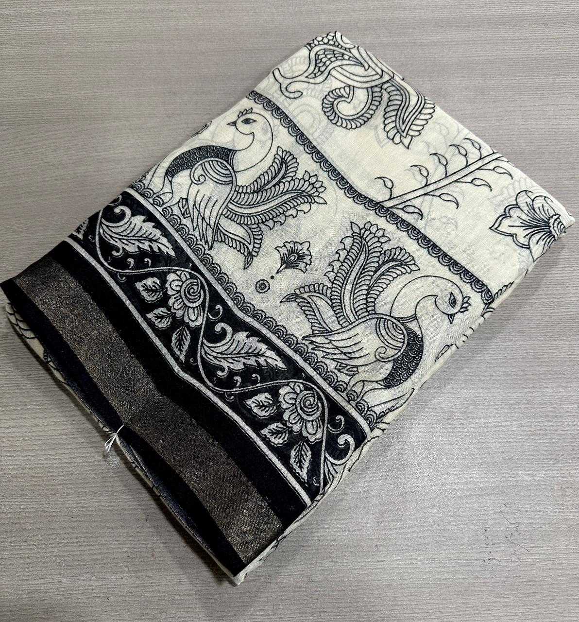 Folded fabric with black and white floral patterns on a gray surface