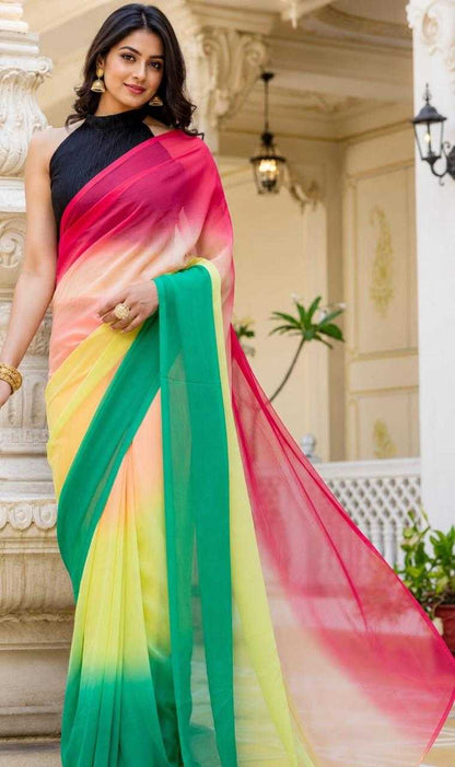 Woman wearing a colorful saree in an elegant indoor setting
