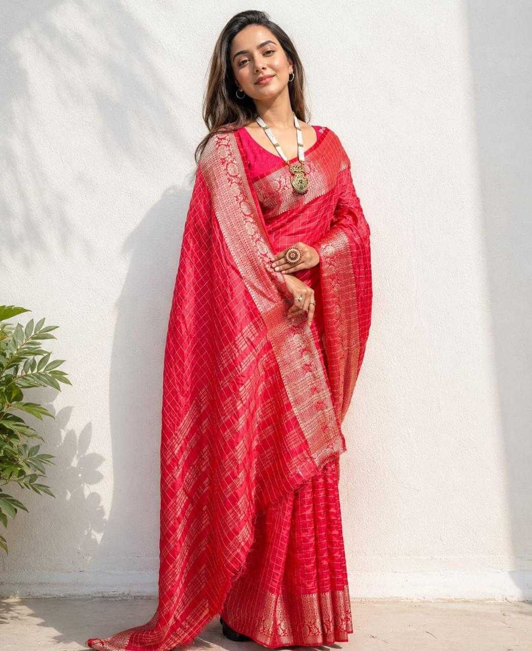 Woman wearing a red saree with a white background
