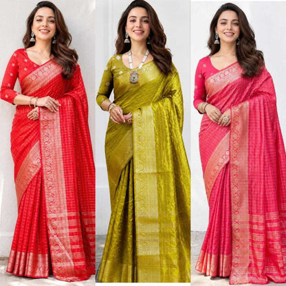 Three women wearing different sarees with a plain background