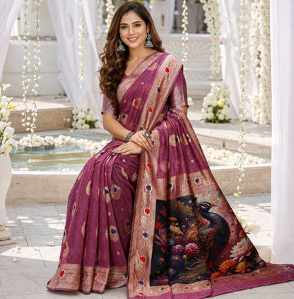 Woman in a traditional saree with intricate designs sitting outdoors.