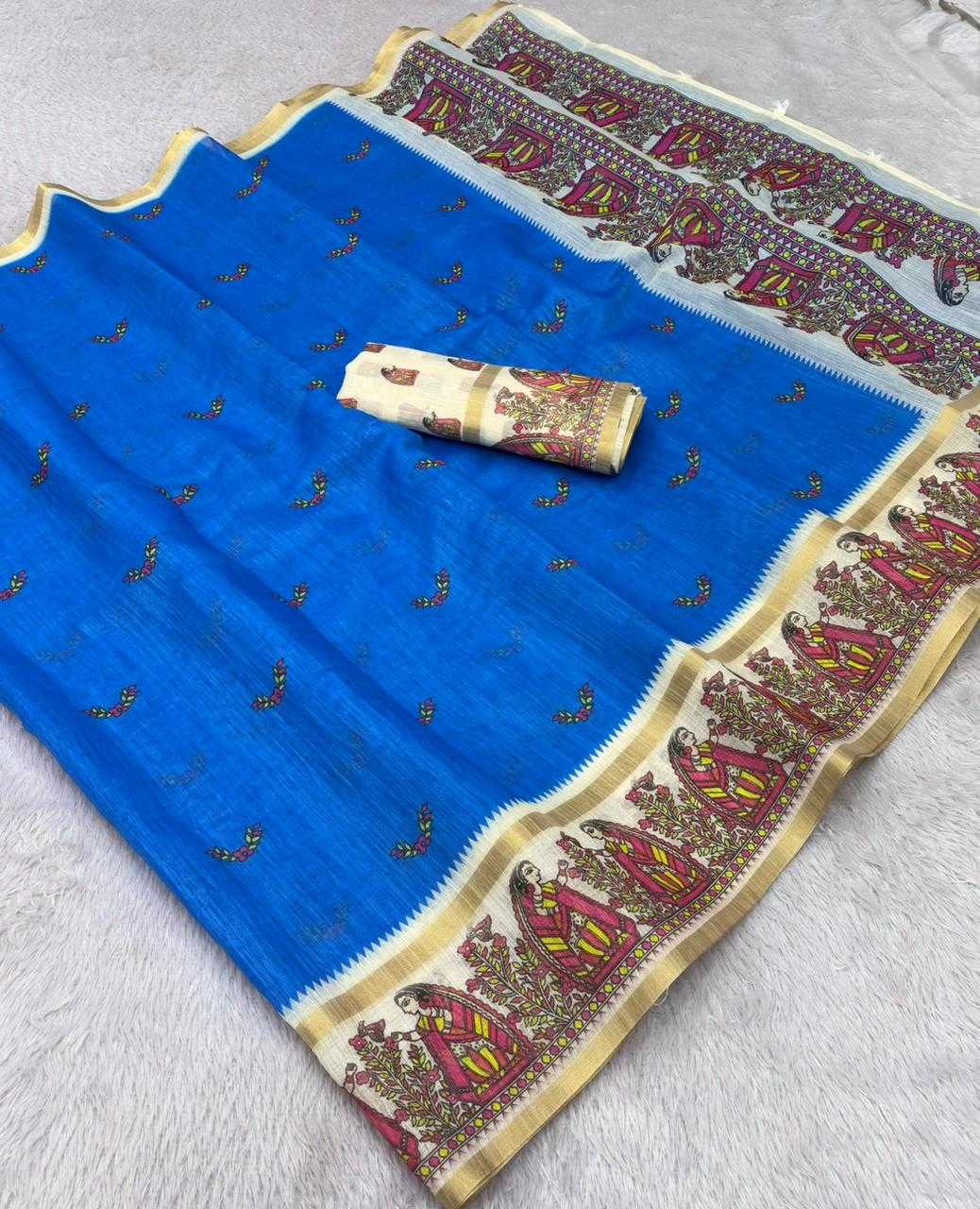 A blue fabric saree or dupatta with a wide ornate border in cream, gold, and red, plus a matching rolled fabric piece placed on top, laid out on a light gray textured surface.