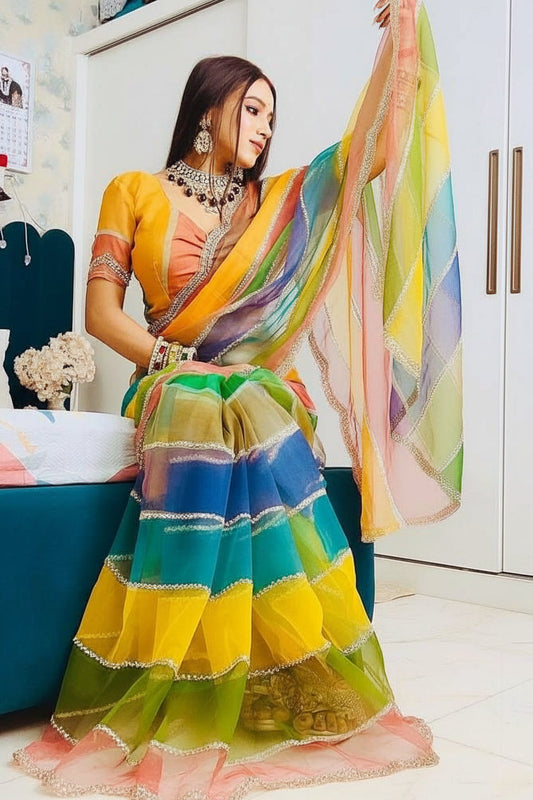 Woman in a colorful saree with a white background