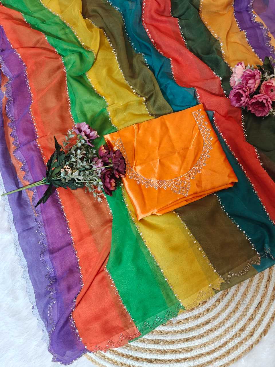 Colorful fabric with a rainbow pattern on a textured surface.
