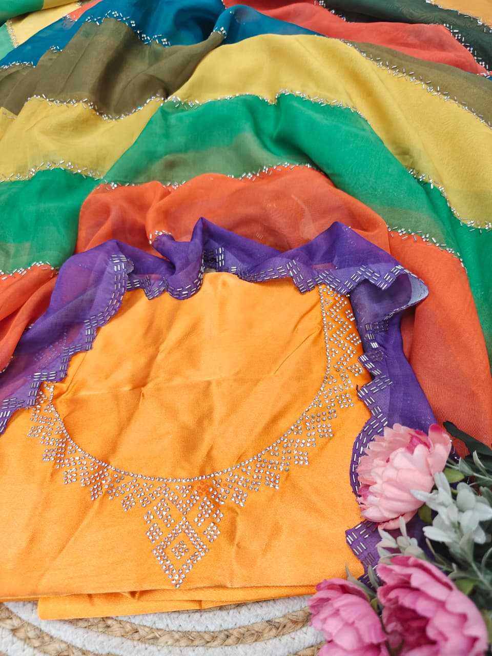 Colorful fabric with embroidery and flowers on a textured surface
