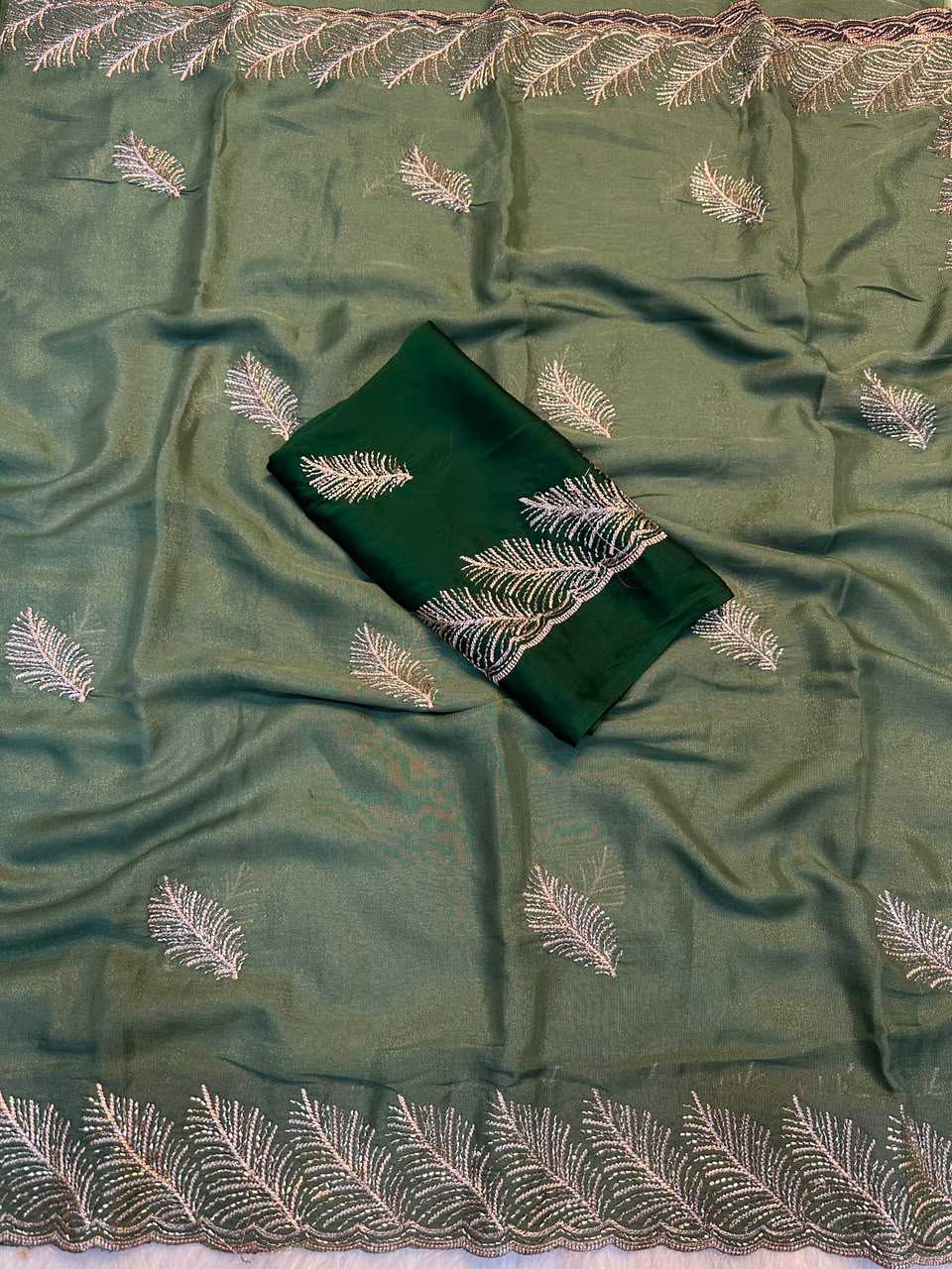 An olive green silk saree or fabric set with a matching dark green fabric piece, both decorated with silver embroidered leaf patterns and a matching embroidered border.