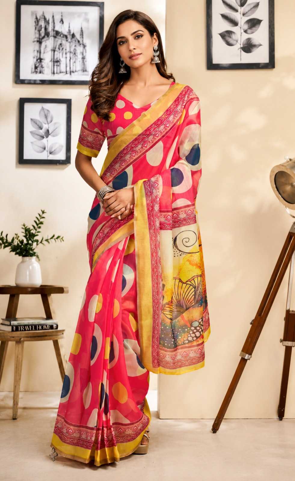 Woman wearing a colorful saree in a room with decor elements.