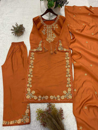 Orange embroidered traditional outfit with matching pants on a white background