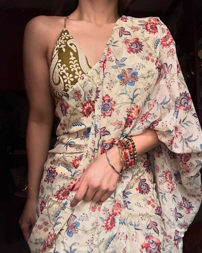 Woman wearing a floral dress with a dark background