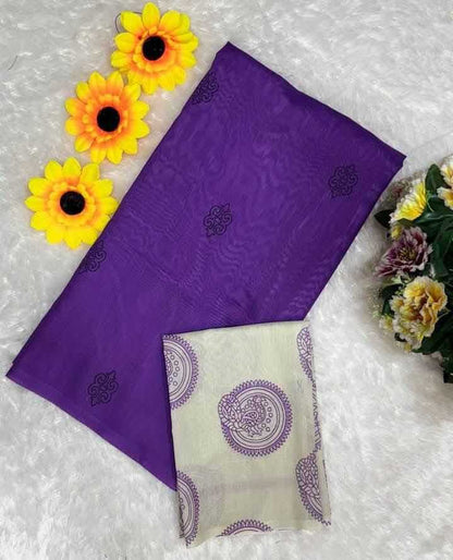 Purple fabric with floral patterns on a textured surface with yellow flowers.