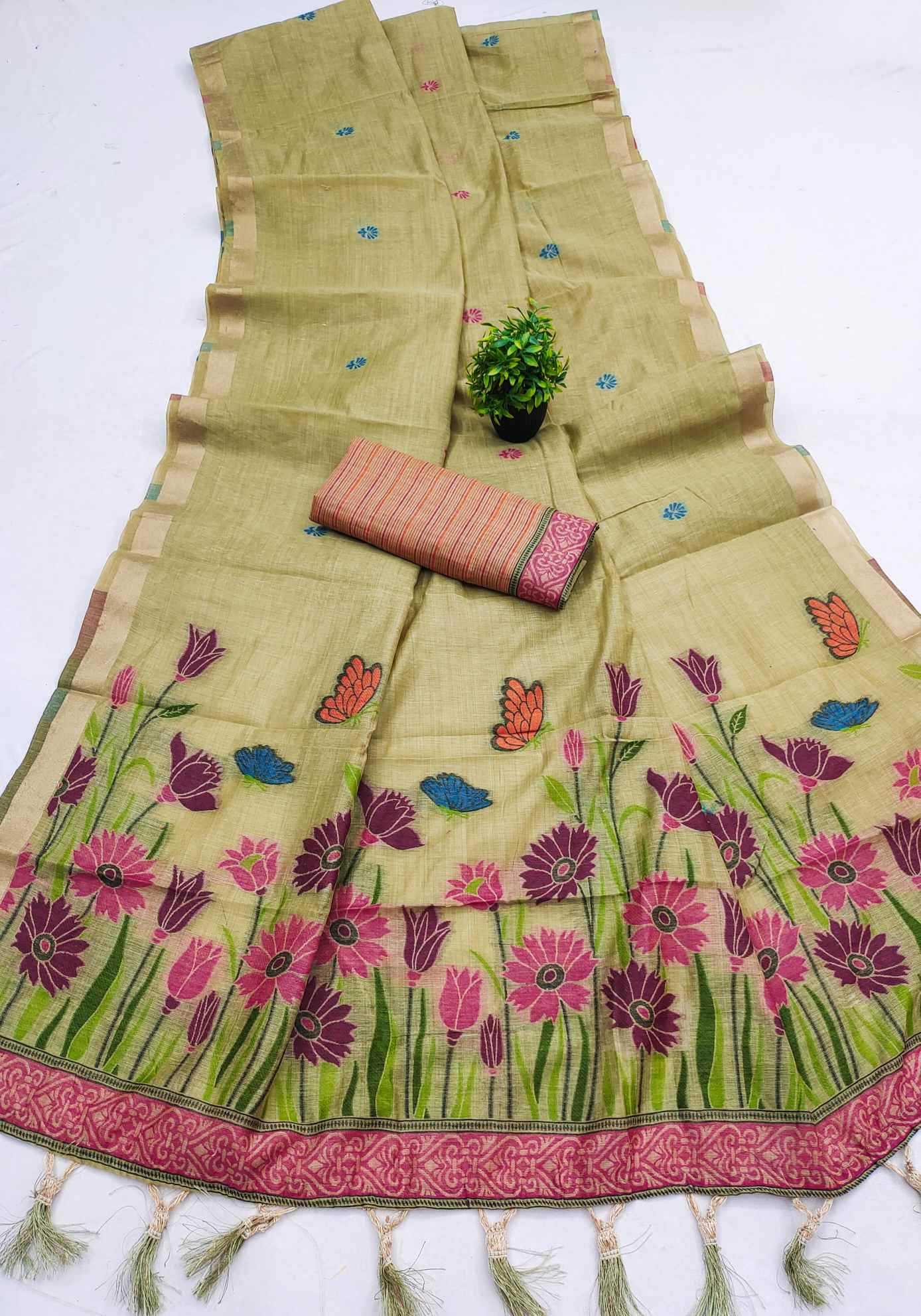 Green saree with floral patterns and a pink border on a white background
