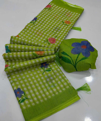 A lime green and white gingham check saree with colorful floral prints, displayed alongside its matching green fabric pouch on a white surface.