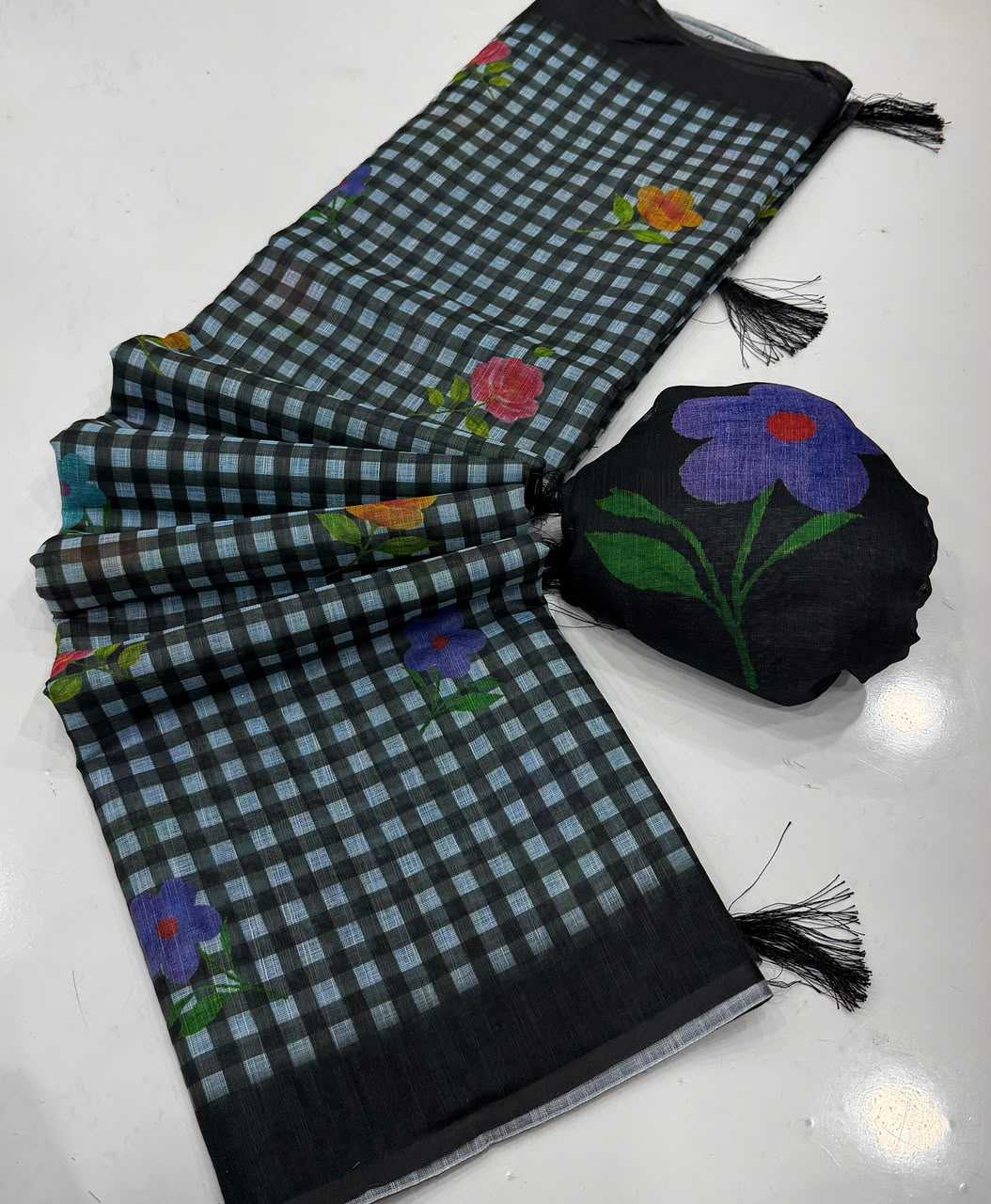 Black and white checkered scarf with floral designs on a white background