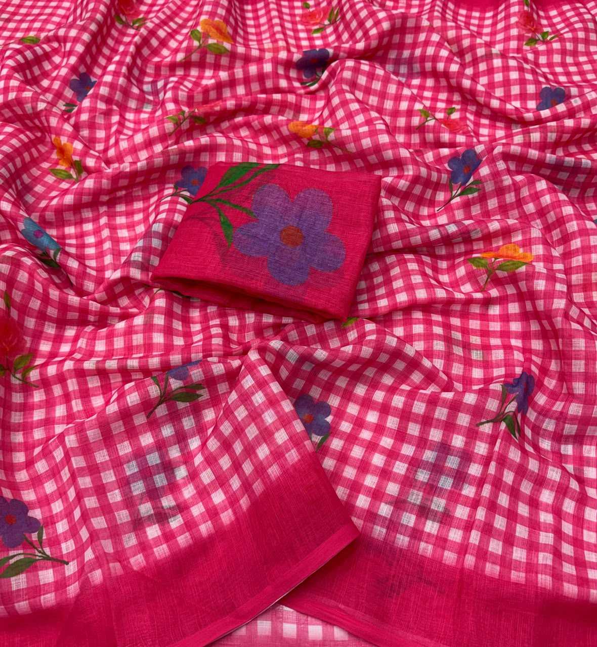 Pink checkered fabric with floral embroidery on a plain background