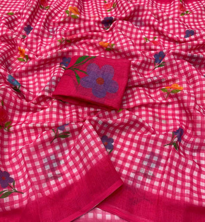 Pink checkered fabric with floral embroidery on a plain background