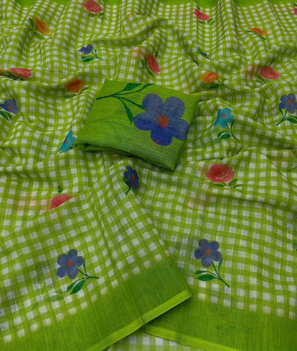 A lime green checkered saree with scattered floral prints in blue, pink, and teal, featuring a matching solid green fabric band.