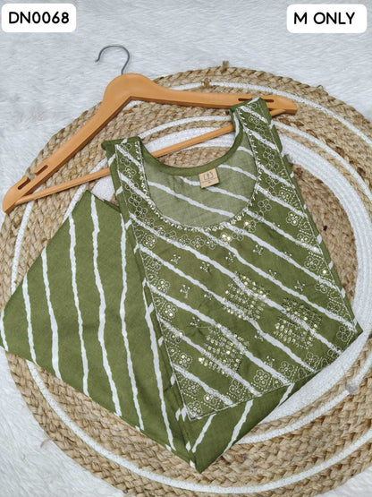 An olive green sleeveless top with white vertical stripes and silver sequin embellishments, displayed on a wooden hanger over a woven round mat.