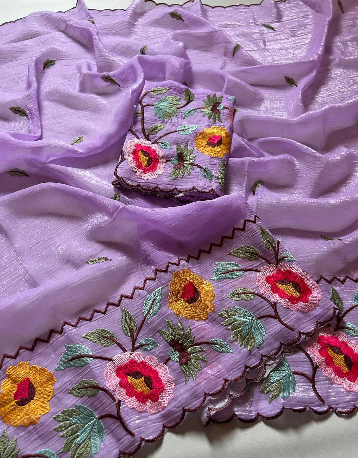 Embroidered fabric with floral patterns on a purple background