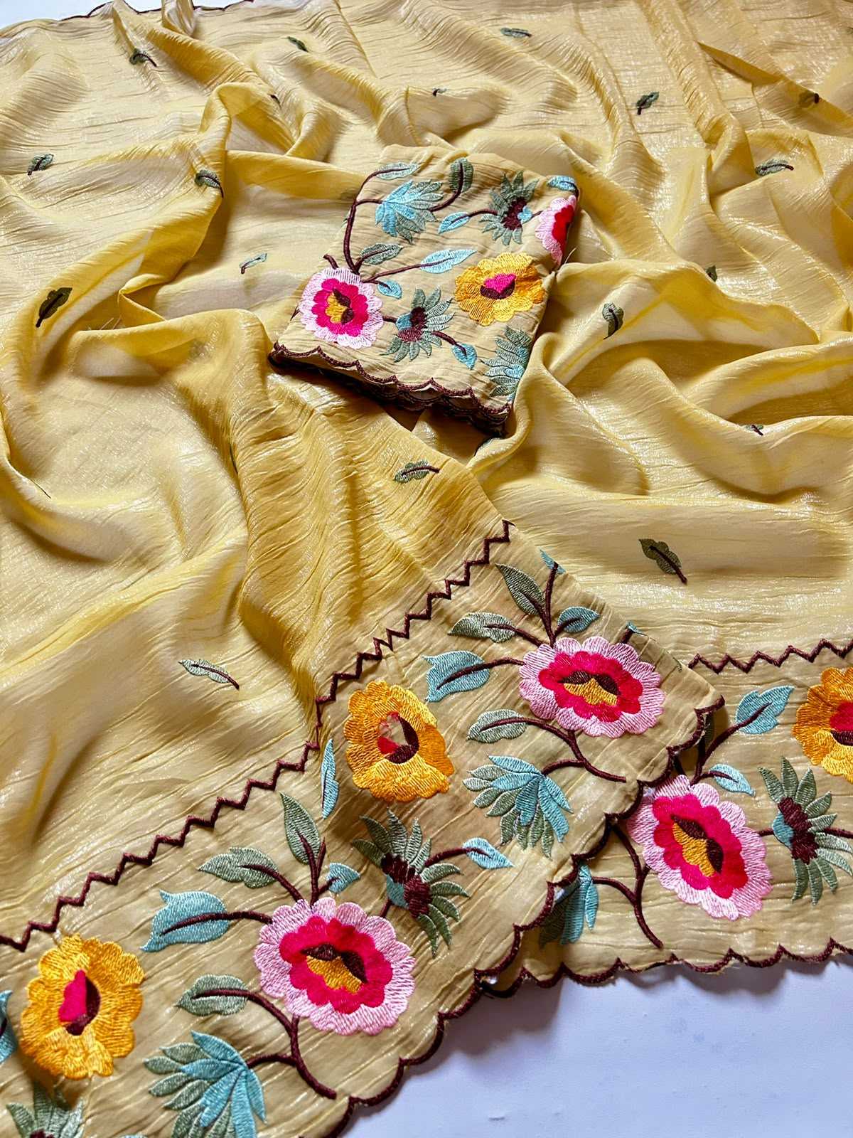 Embroidered fabric with floral patterns on a yellow background