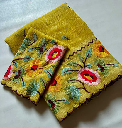Yellow fabric with floral embroidery on a white background