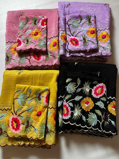 Four embroidered fabric squares in pink, purple, yellow, and black with floral patterns on a white background.