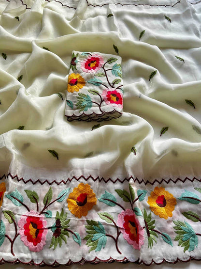 Embroidered fabric with floral patterns on a white background