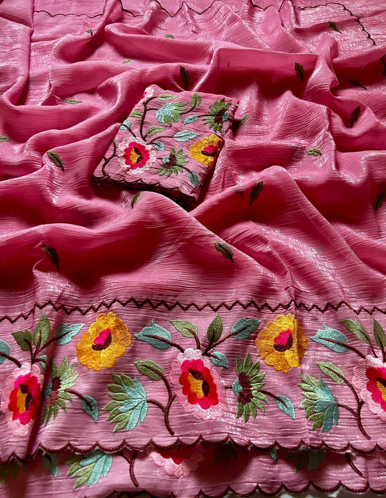 Pink fabric with floral embroidery