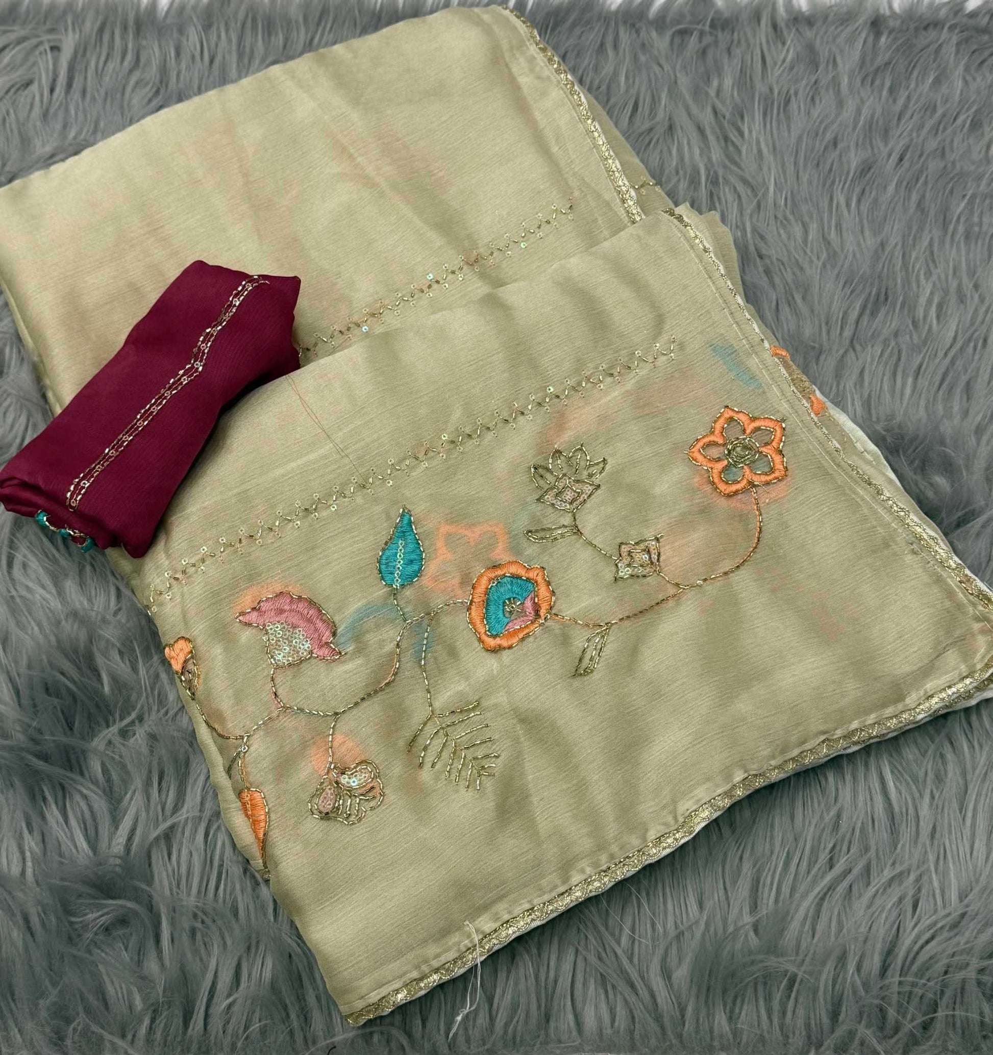 Embroidered fabric with floral patterns on a textured surface
