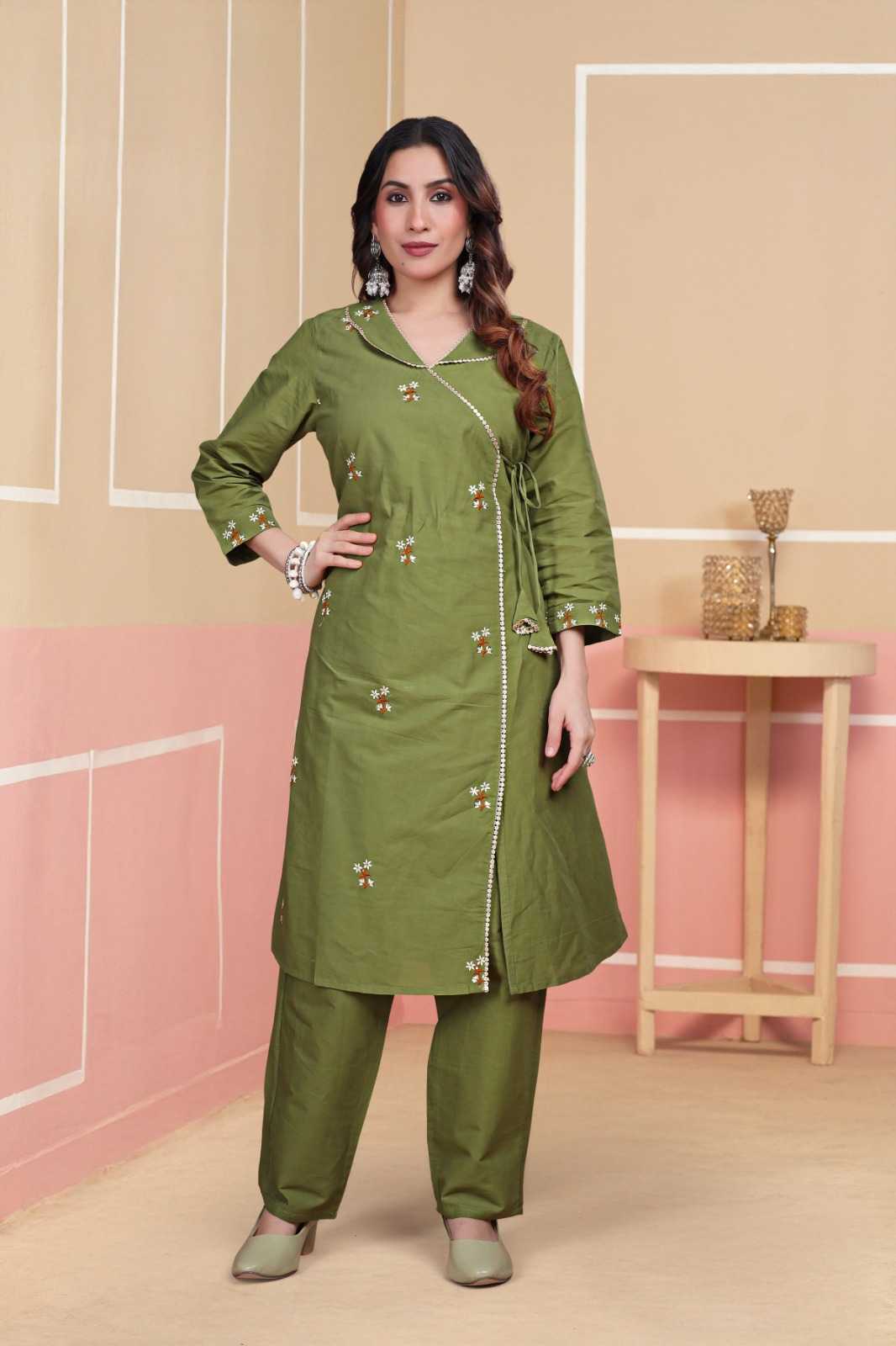 Woman wearing a green traditional outfit with a beige background