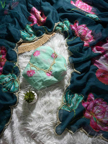 Decorative green fabric pouch with floral embroidery on a textured surface