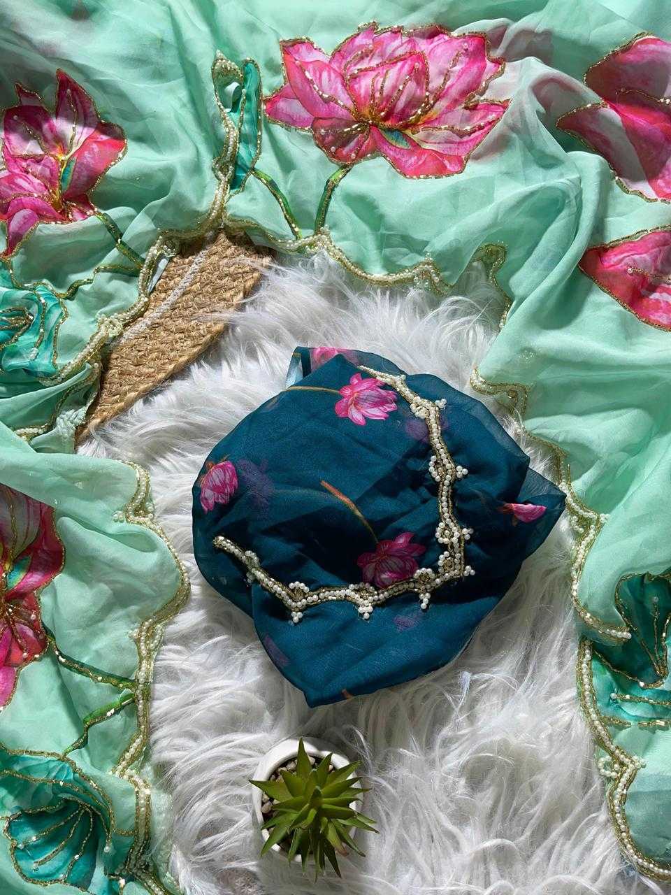 Decorative fabric with floral patterns and a blue pouch on a white background