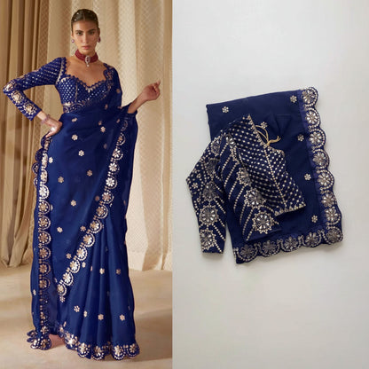 Navy blue saree with intricate gold embroidery on a plain background