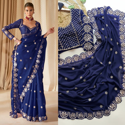 A navy blue saree with intricate silver and gold floral embroidery and a scalloped border, shown on a model and in a close-up detail view.