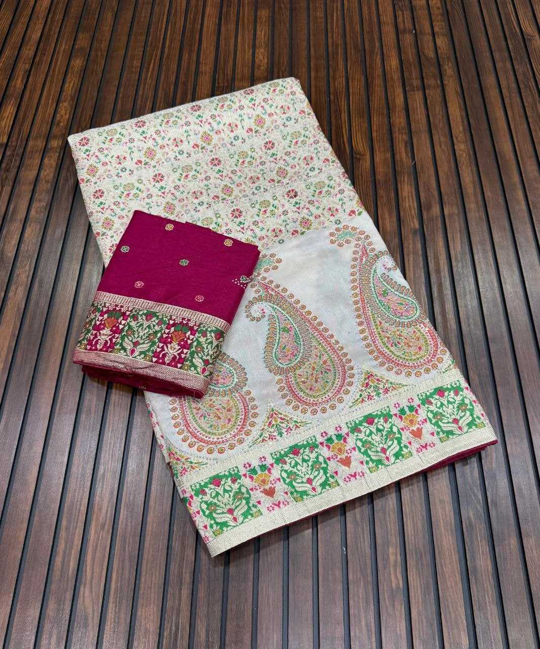 Saree with a pink blouse on a wooden surface