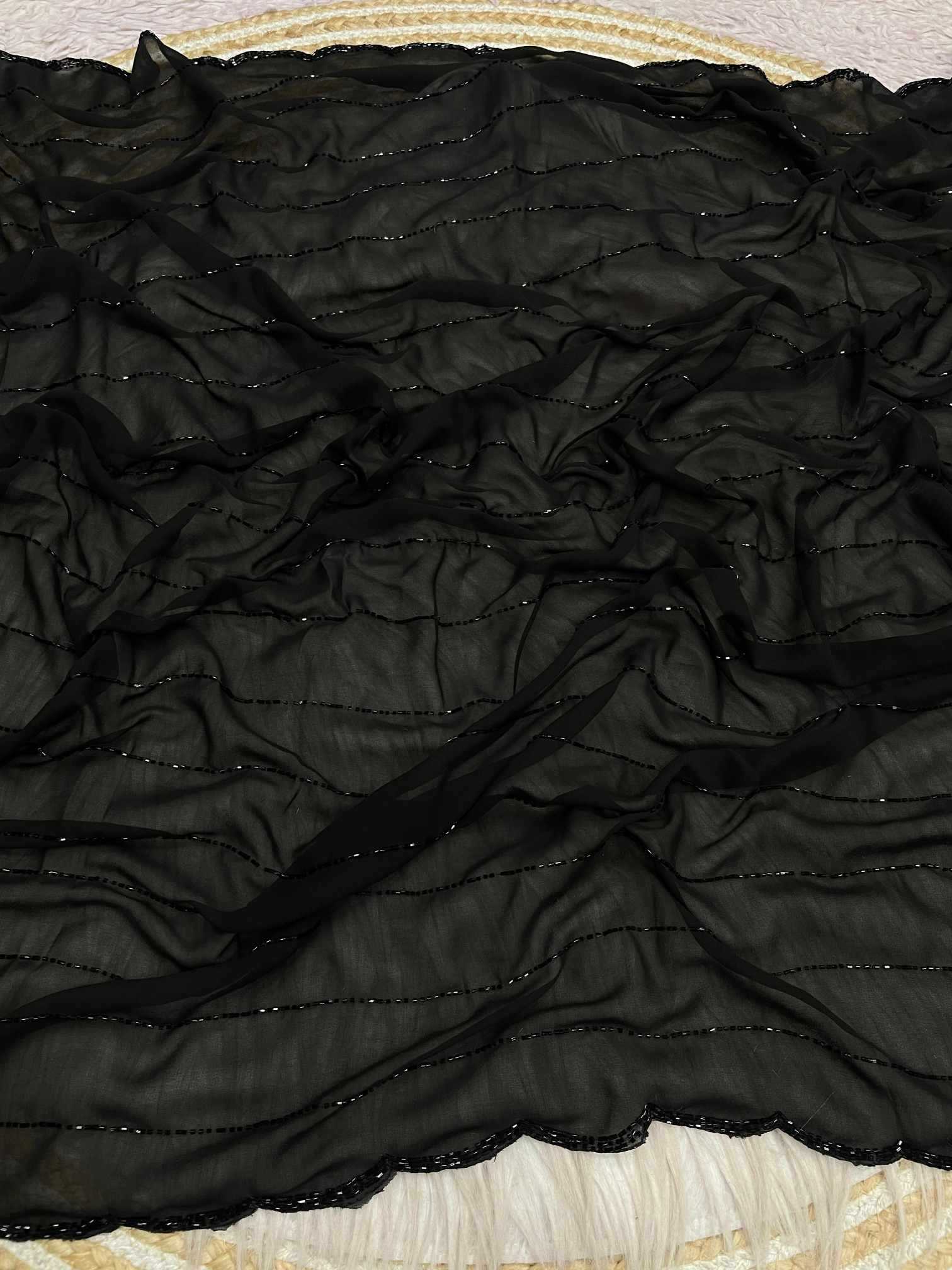 Black textured fabric on a textured surface