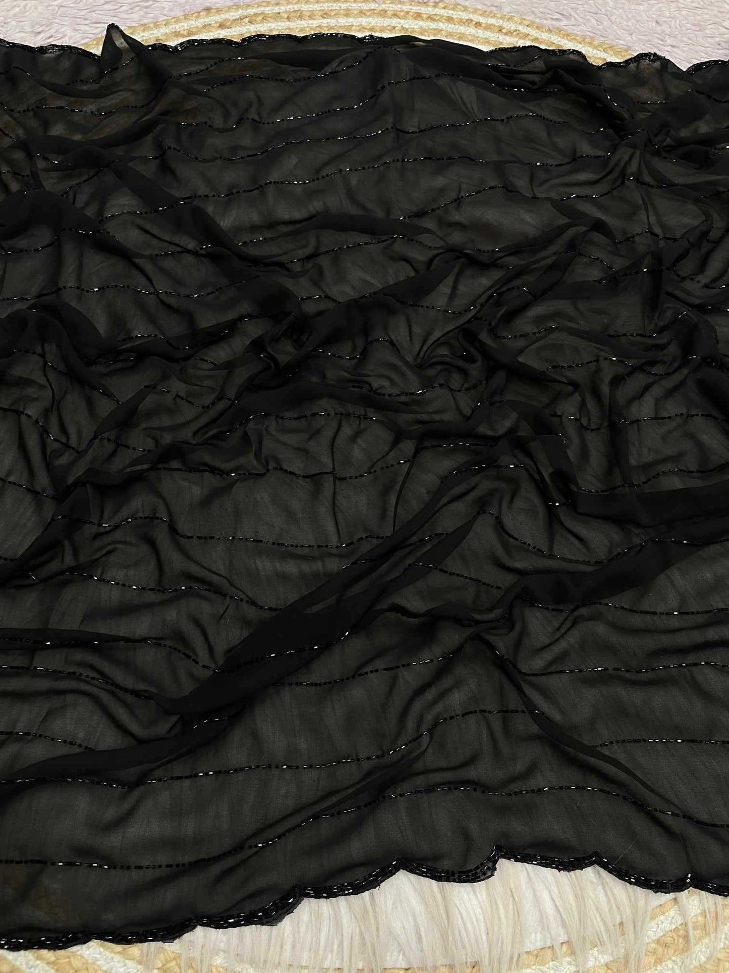 Black textured fabric on a textured surface
