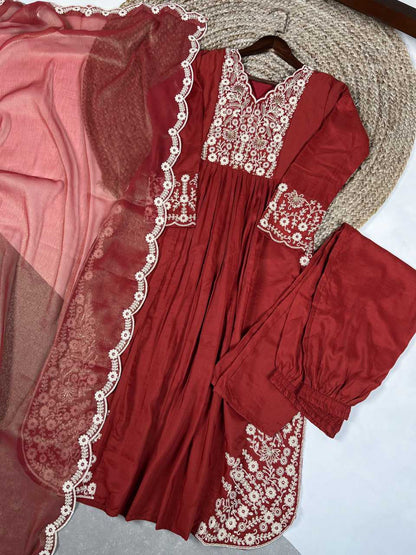 Red embroidered traditional outfit with a pink dupatta on a white background