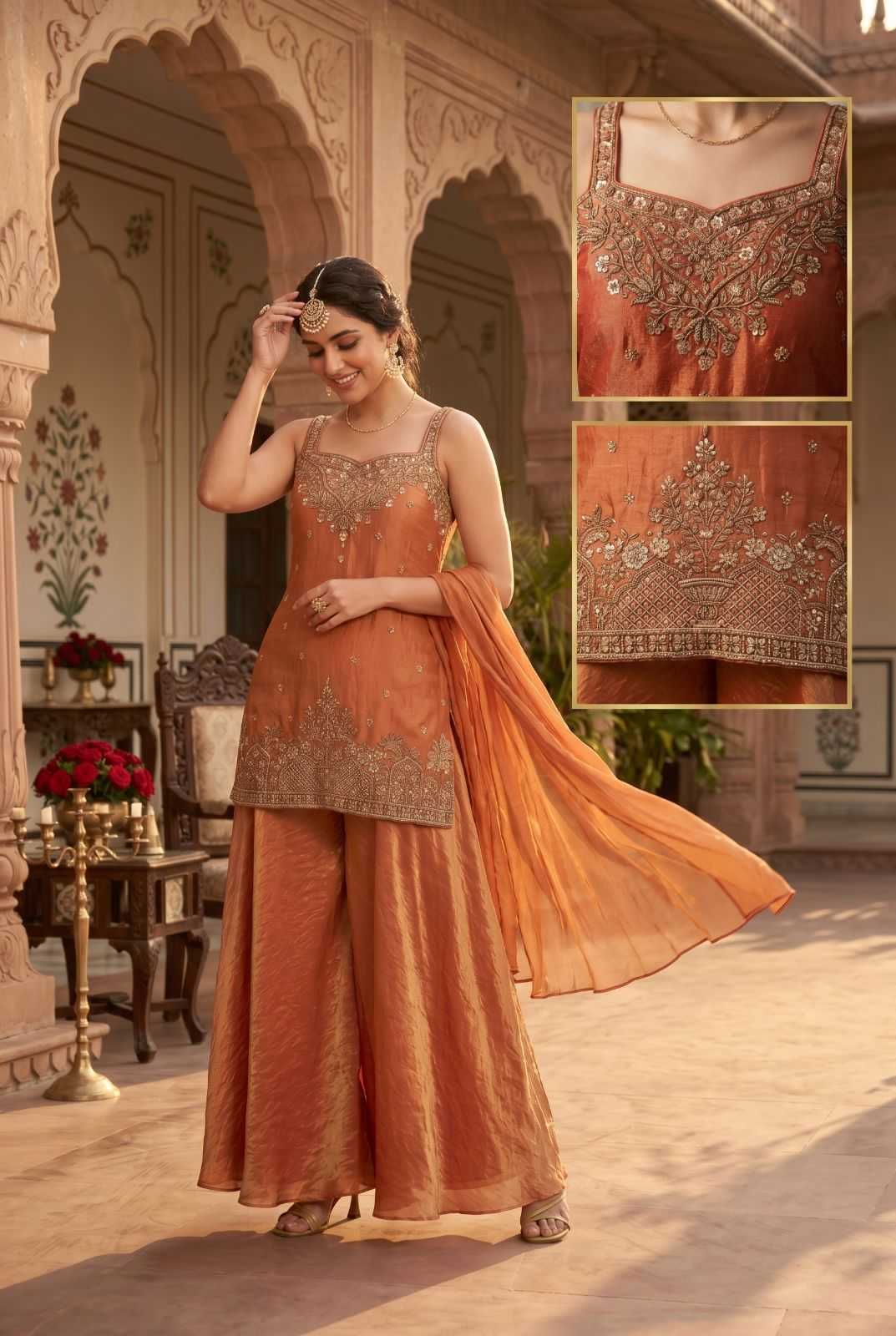 Woman in an orange traditional outfit with intricate detailing in a decorative setting.